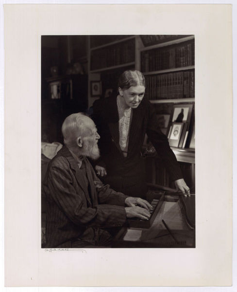 Portrait of George Bernard Shaw playing the spinet with Blanche …