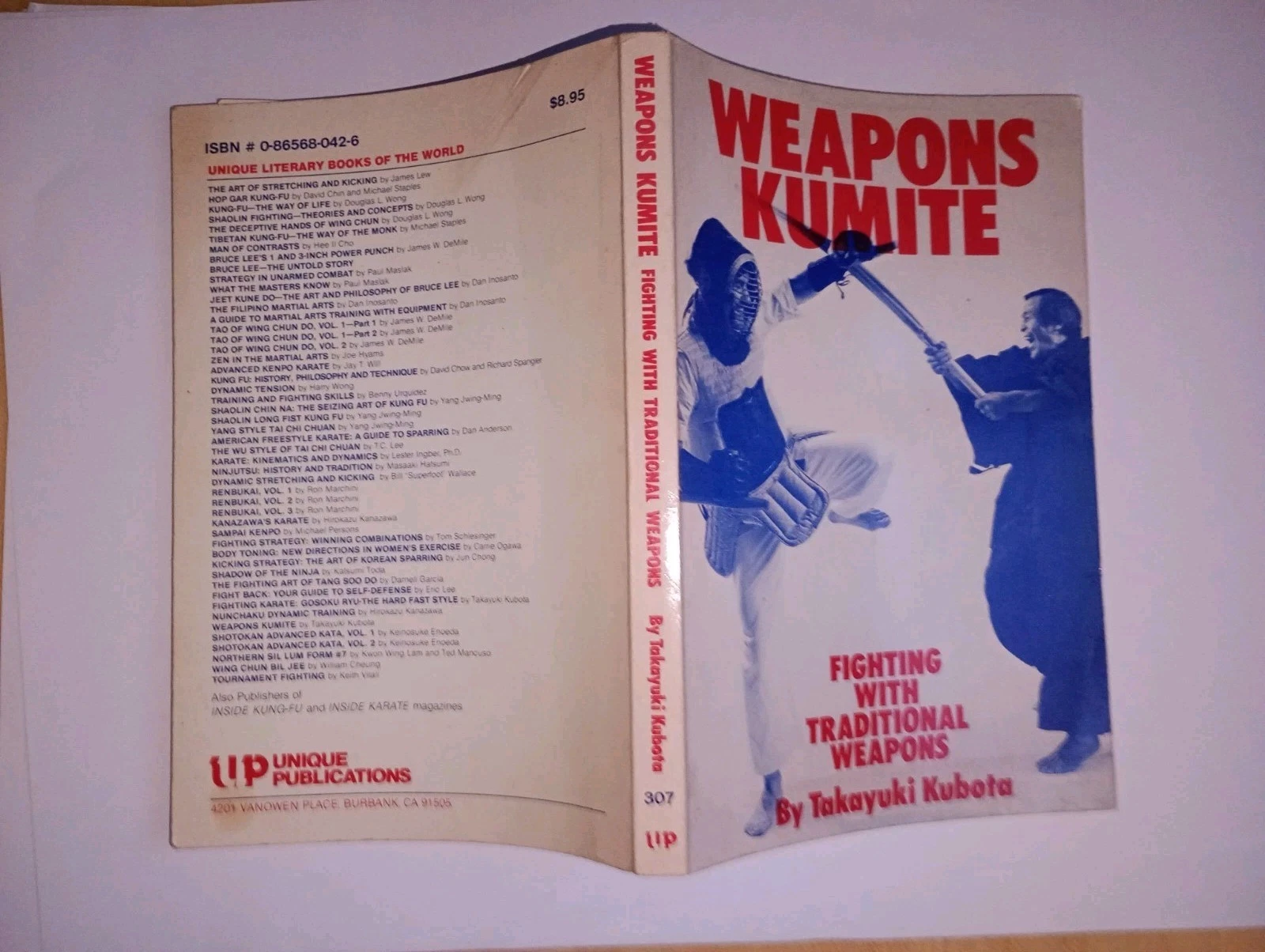 Weapons kumite. fighting with traditional weapons