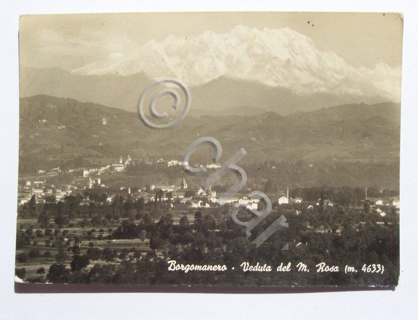 Cartolina Borgomanero - Panorama col M. Rosa 1951.
