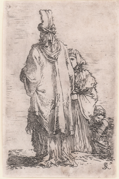 Vecchio orientale di spalle e due donne