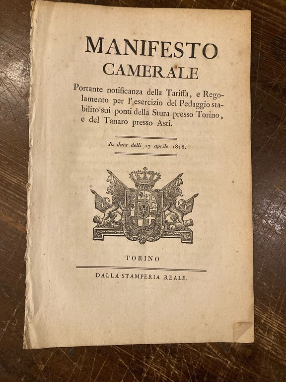 Manifesto Camerale portante notificanza della Tariffa, e Regolamento per l'esercizio del Pedaggio stabilito sui Ponti della Stura presso Torino, e del Tanaro presso Asti. In data delli 17 aprile 1818