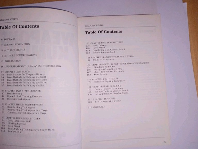 Weapons kumite. fighting with traditional weapons