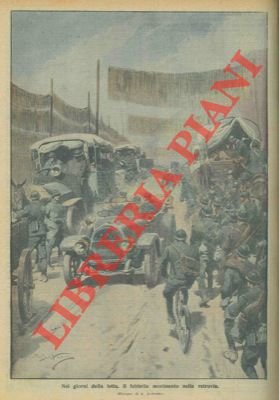 Il febbrile movimento di uomini, camion e auto nelle retrovie.