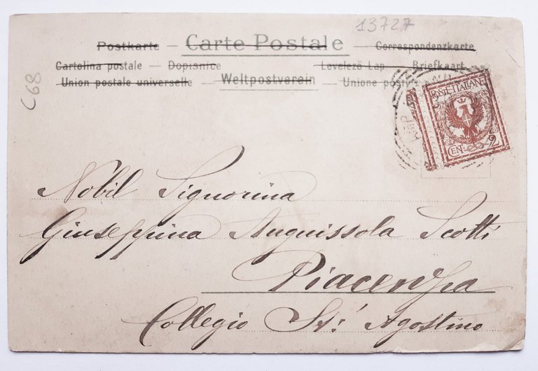 Cartolina angelo con fiori e animali con glitter viaggiata 1902