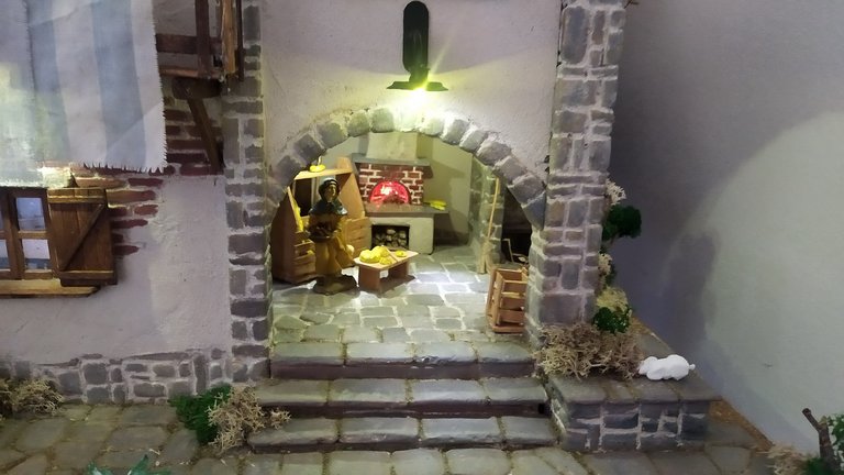 Diorama raffigurante casa rurale con forno per il pane