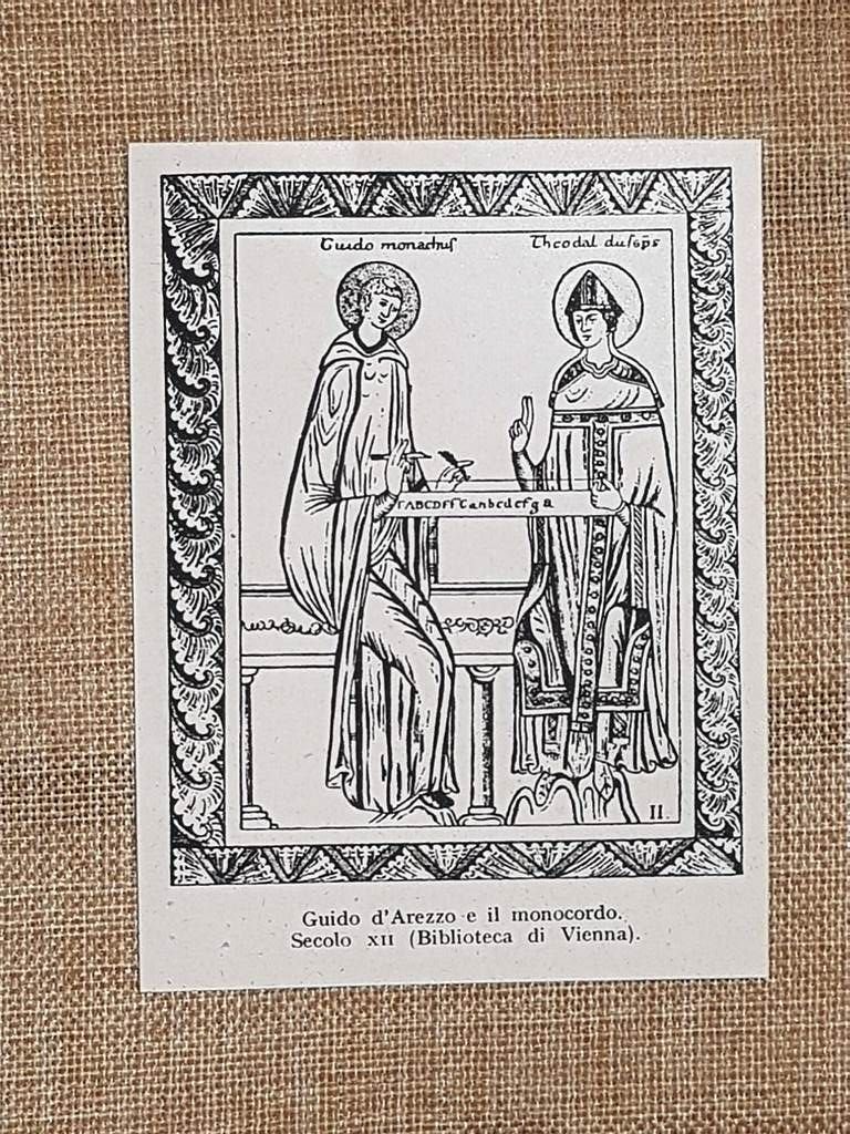 Guido d'Arezzo illustra monocordo rivoluzionando teoria musicale Stampa del 1944