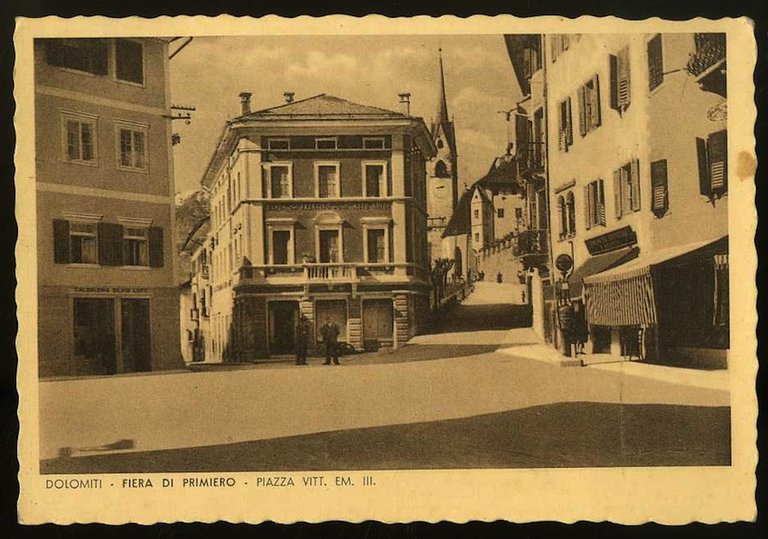 Dolomiti - Fiera di Primiero. Piazza Vitt. Em. III.