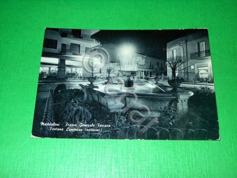 Cartolina Maddaloni - Piazza Generale Ferrara - Fontana luminosa 1965.