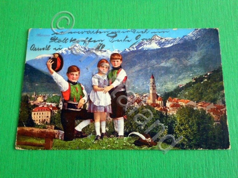 Cartolina Merano - Costumi e scorcio panoramico 1931