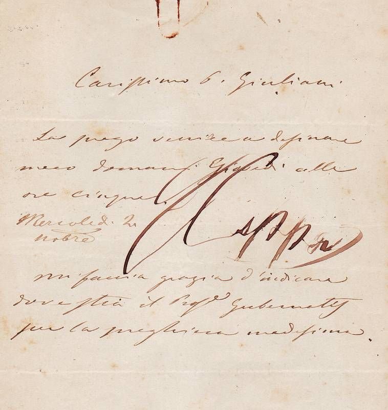 Biglietto autografo con grande firma sovrapposta al testo.