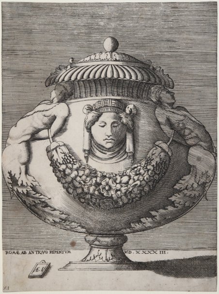 Vaso con maschera e festone